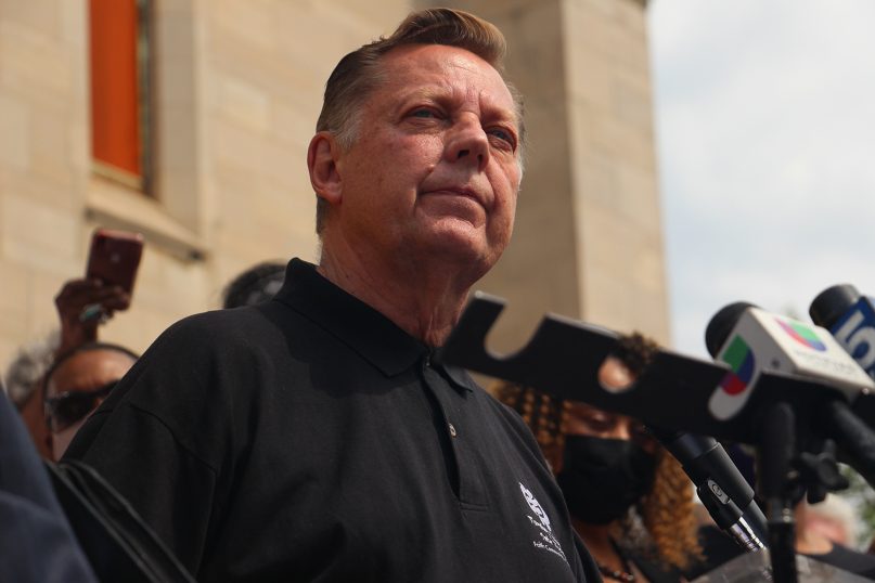 The Rev. Michael Pfleger addresses supporters and media May 24, 2021, outside his church, the Faith Community of St. Sabina in Chicago's Auburn-Gresham neighborhood. RNS photo by Emily McFarlan Miller
