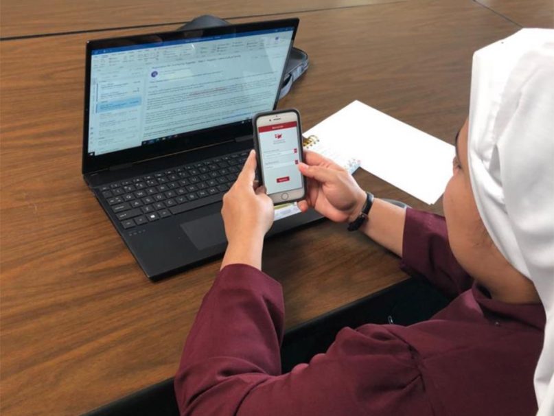 A nun learns how to use an app developed by Catholic Extension. Photo courtesy of Catholic Extension