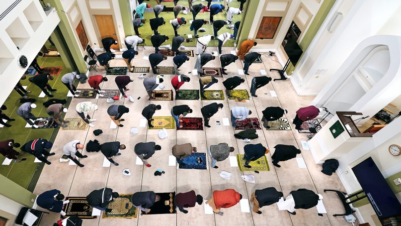 Worshippers bow in prayer at the Islamic Society of Boston during the first Friday of the holy month of Ramadan, April 16, 2021, in Boston. (AP Photo/Charles Krupa)