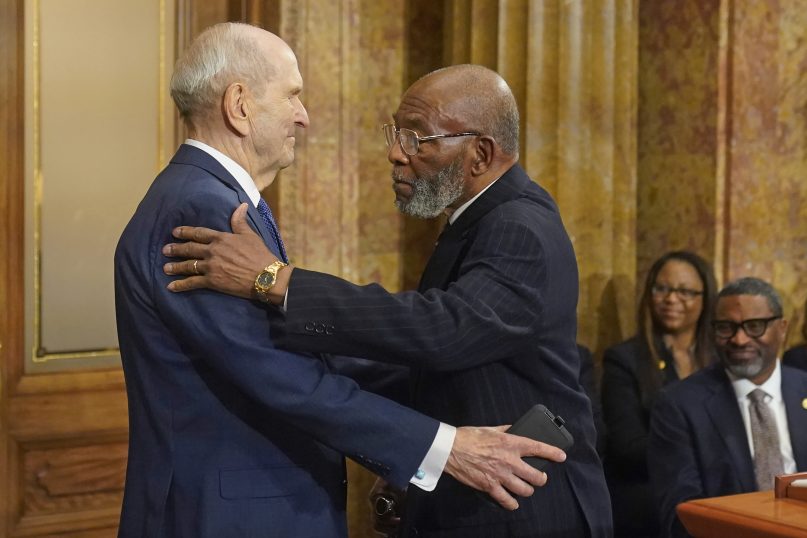 The Rev. Amos C. Brown, right, and President Russell M. Nelson of The Church of Jesus Christ of Latter-day Saints hug during a news conference June 14, 2021, in Salt Lake City. Top leaders from the NAACP and The Church of Jesus Christ of Latter-day Saints announced $9.25 million in new educational and humanitarian projects as they seek to build on an alliance formed in 2018. (AP Photo/Rick Bowmer)