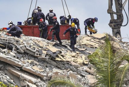 South Florida Urban Search and Rescue team look for survivors at the 12-story oceanfront condo, Champlain Towers South on Saturday, June 26, 2021, that partially collapsed early Thursday morning in the Surfside area of Miami. (Al Diaz/Miami Herald via AP)