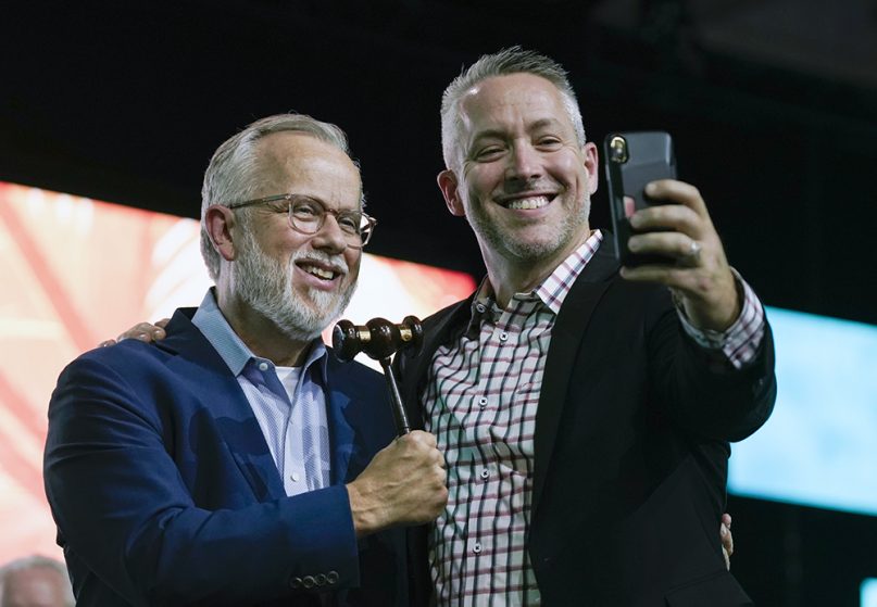 Newly elected Southern Baptist Convention President Ed Litton, left, and outgoing president J.D. Greear take a selfie after Greear pounded the gavel for the last time June 16, 2021, to close the SBC annual meeting. Litton will open the 2022 SBC annual meeting in Anaheim, California, with the pound of the gavel. Photo by Robin Jackson/Baptist Press