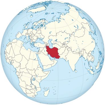 Iran, red, on a world map. Map courtesy of Creative Commons
