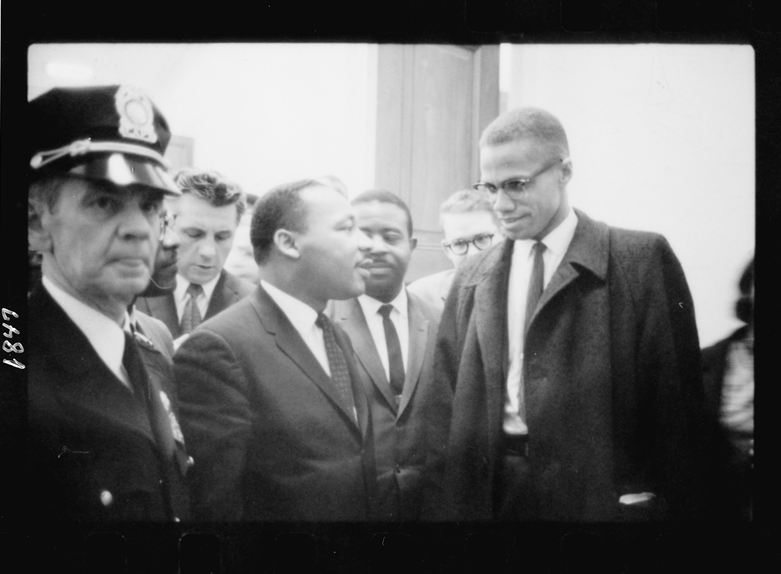 The Rev. Martin Luther King Jr., center left, and Malcolm X speak after King's press conference at the U.S. Capitol about the Senate debate on the Civil Rights Act of 1964. Photo by Marion S. Trikosko/Library of Congress/Creative Commons