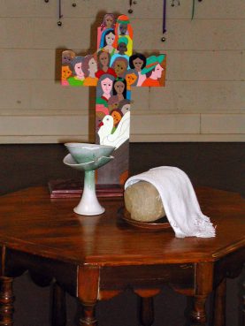 The Community of Hope Church communion table in Tulsa, Oklahoma. The congregation used a Broken Made Whole chalice, left. Photo courtesy of Leslie Penrose