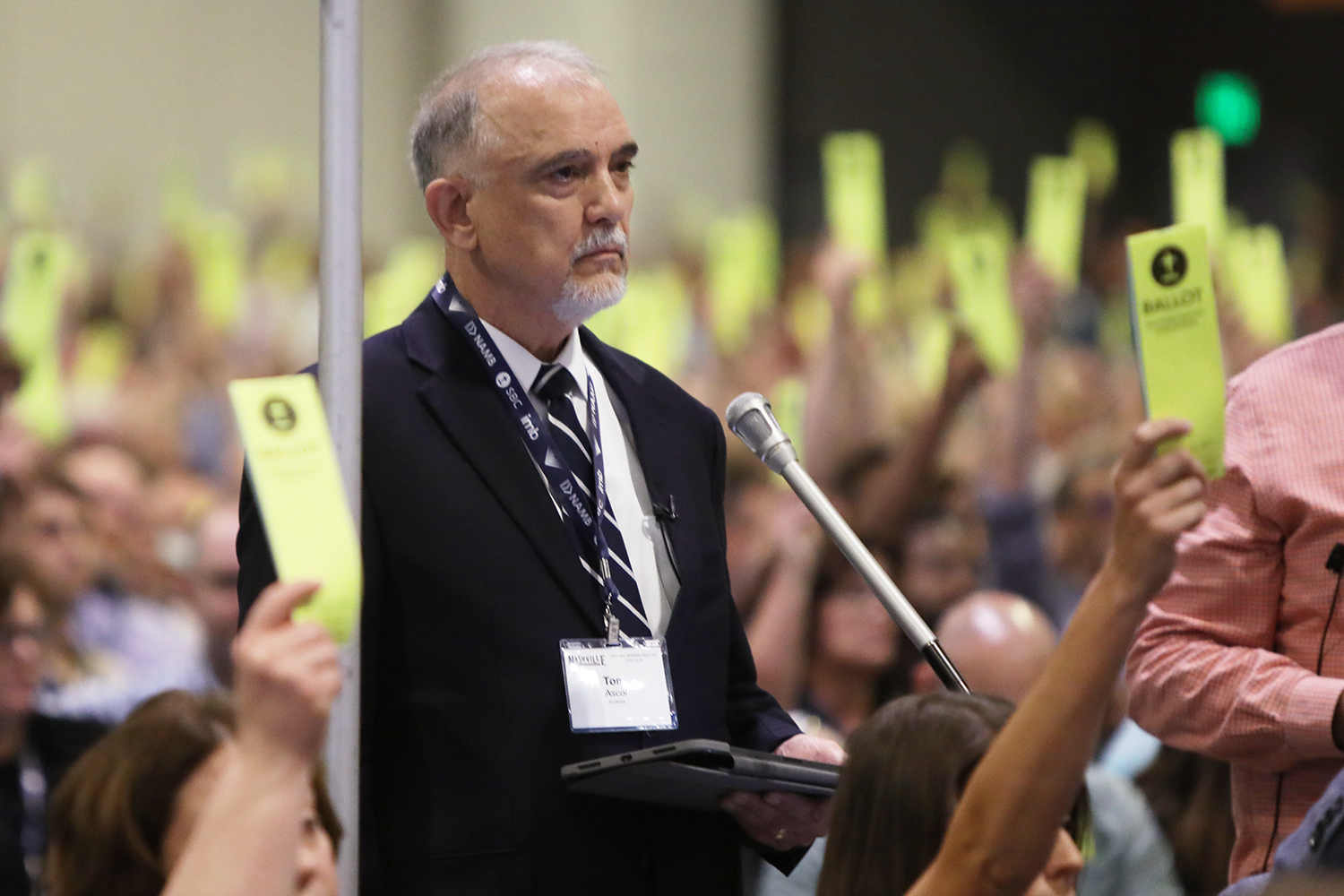 Tom Ascoll waits near a mic during the SBC annual meeting at the Music City Center in Nashville, Tuesday, June 15, 2021. RNS Photo by Kit Doyle