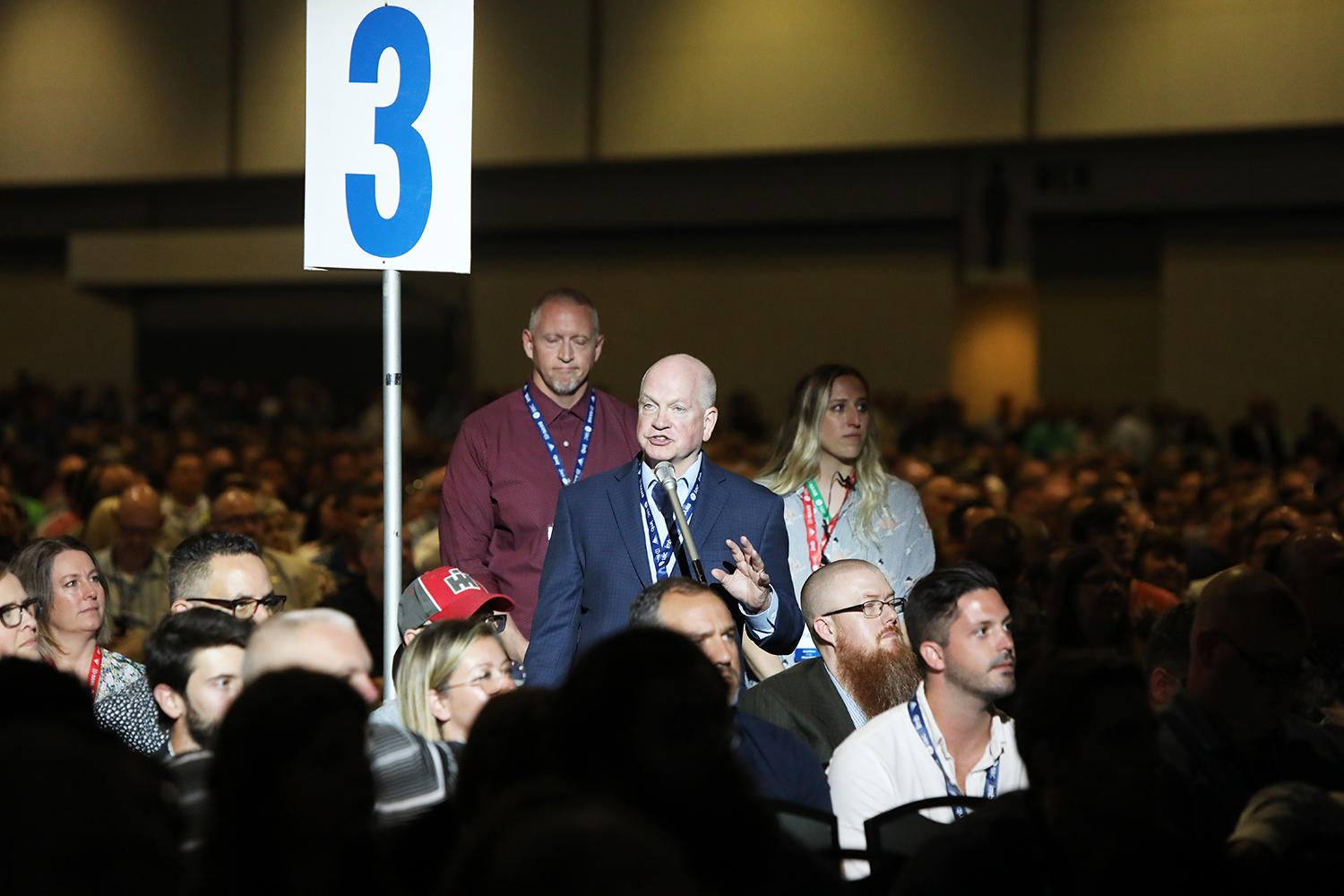 Danny Akin waits near a mic during the SBC annual meeting at the Music City Center in Nashville, Tuesday, June 15, 2021. RNS Photo by Kit Doyle