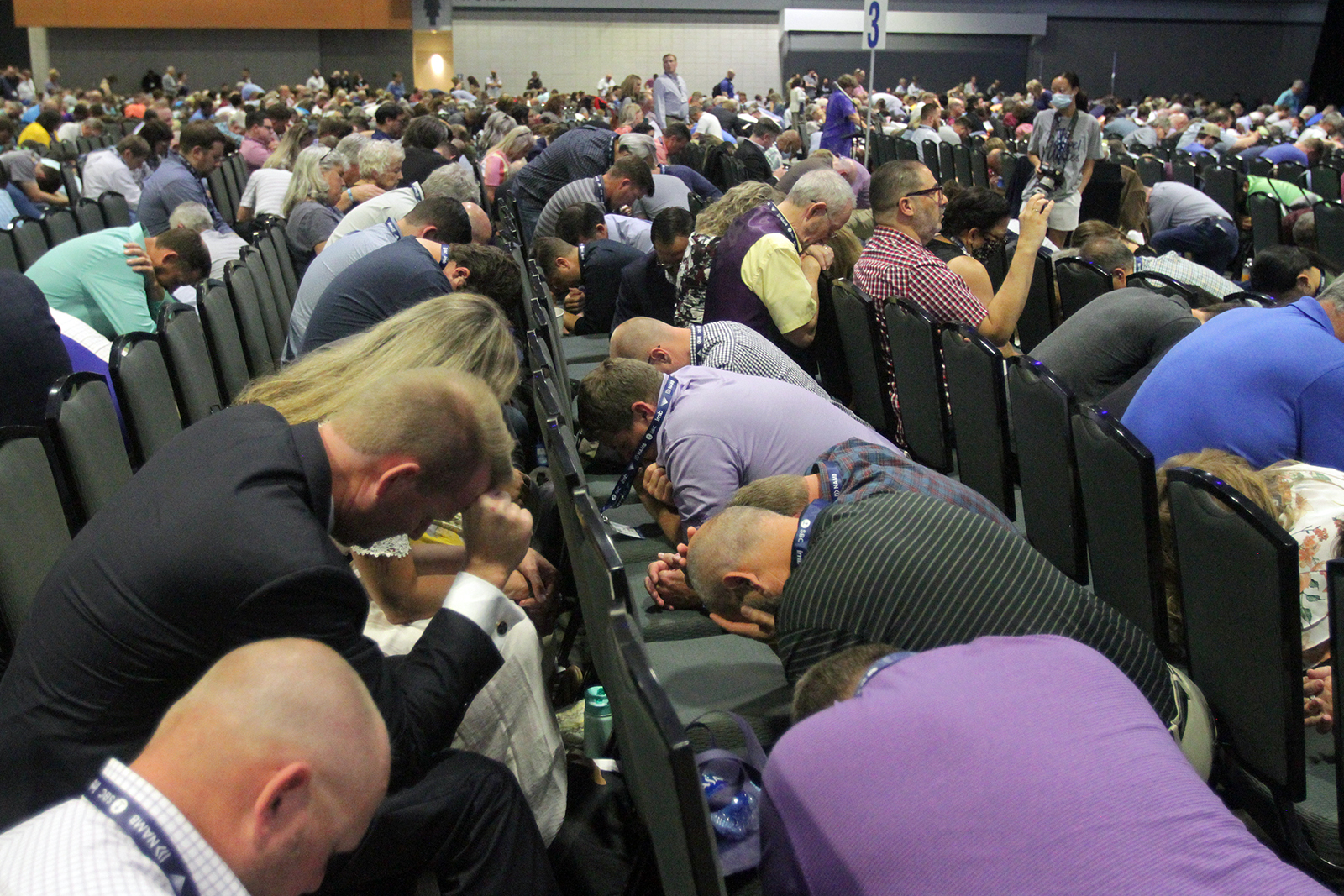 Southern Baptist Convention messengers kneel in prayer during the annual meeting, Tuesday, June 15, 2021, at the Music City Center in Nashville. RNS photo by Kit Doyle