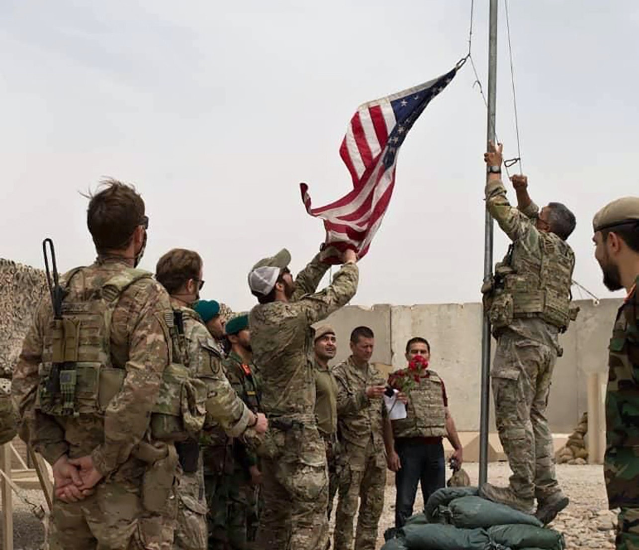A handover ceremony in July 2021, as U.S. troops prepare to leave Afghanistan. (Afghan Ministry of Defense Press Office via AP)