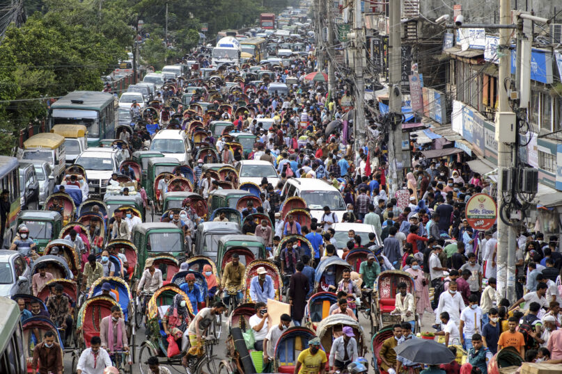 People crowd a market area ahead of Eid-al Adha in Dhaka, Bangladesh, Friday, July 16, 2021. Millions of Bangladeshis are shopping and traveling during a controversial eight-day pause in the country’s strict coronavirus lockdown that the government is allowing for the Islamic festival Eid-al Adha. (AP Photo/Mahmud Hossain Opu)