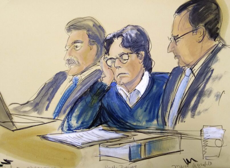 FILE - In this June 18, 2019, file courtroom artist's sketch, defendant Keith Raniere, center, sits with attorneys Paul DerOhannesian, left, and Marc Agnifilo during closing arguments at Brooklyn federal court in New York. Raniere, the former leader of the cult-like NXIVM group, has been ordered to pay $3.5 million to 21 victims of a sex-trafficking scheme. (Elizabeth Williams via AP, File)