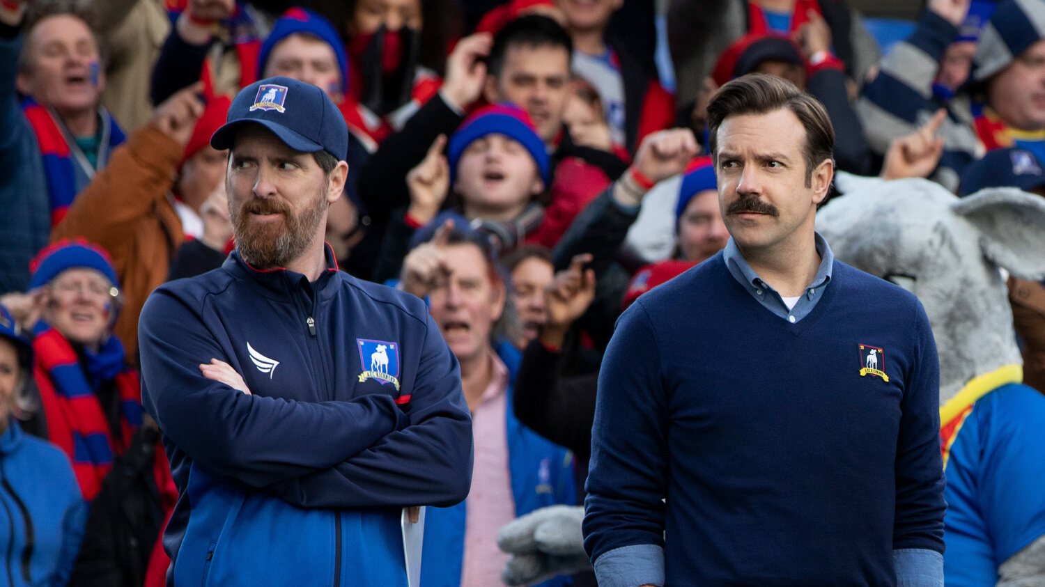 Brendan Hunt as Coach Beard, left, and Jason Sudeikis as Ted Lasso in the Apple TV+ series “Ted Lasso.” Photo courtesy of Apple TV+