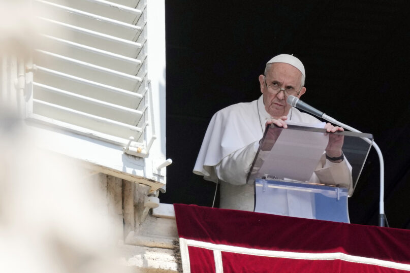 Pope Francis reads his message during the Angelus noon prayer from the window of his studio overlooking St. Peter’s Square at the Vatican, July 18, 2021. (AP Photo/Alessandra Tarantino)