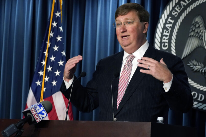 Mississippi Gov. Tate Reeves speaks about the state contracting with four vendors to provide over 1,000 medical personnel to multiple hospitals statewide to meet the staffing shortages due to the COVID-19 pandemic, during a news briefing Aug. 24, 2021, in Jackson, Mississippi. (AP Photo/Rogelio V. Solis)