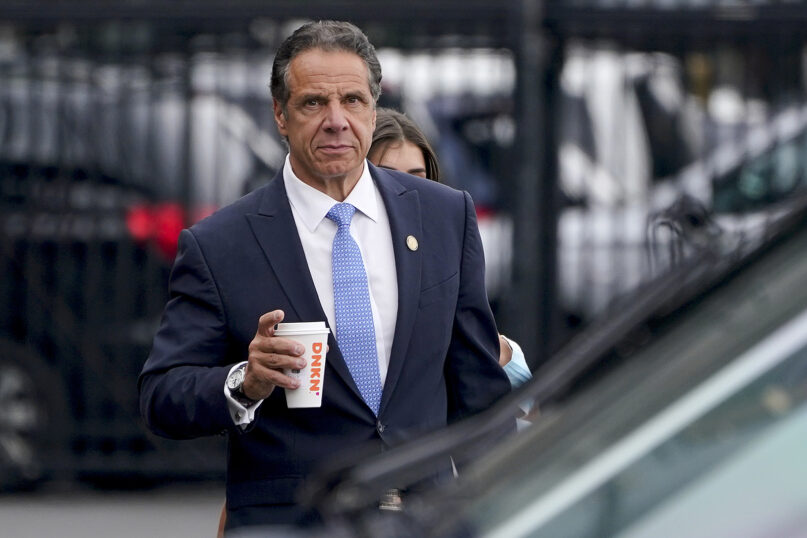 New York Gov. Andrew Cuomo prepares to board a helicopter after announcing his resignation Aug. 10, 2021, in New York. Cuomo says he will resign over a barrage of sexual harassment allegations. The three-term Democratic governor's decision, which will take effect in two weeks, was announced Tuesday as momentum built in the Legislature to remove him by impeachment. (AP Photo/Seth Wenig)