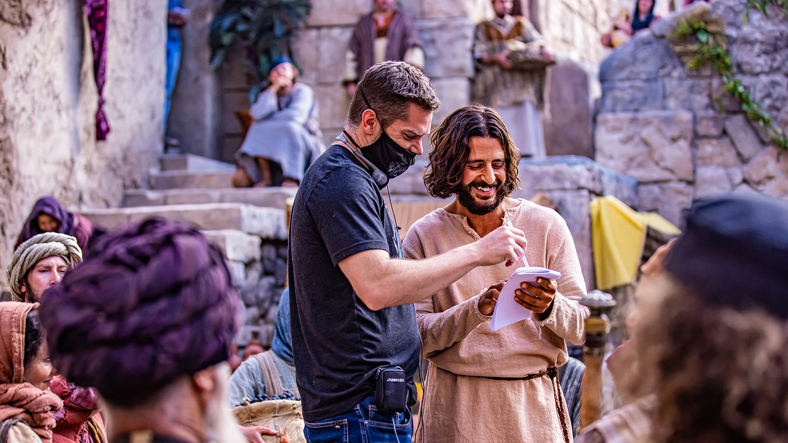 Director Dallas Jenkins, left, speaks with actor Jonathan Roumie, who portrays Jesus Christ, on the set of “The Chosen.” Photo courtesy of Angel Studios