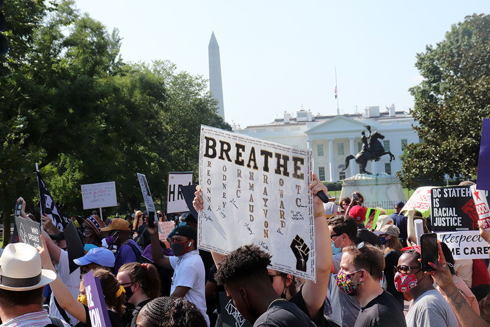 Participants in March On for Voting Rights pass the White House and Black Lives Matter Plaza on August 28, 2021. RNS photo by Adelle M. Banks
