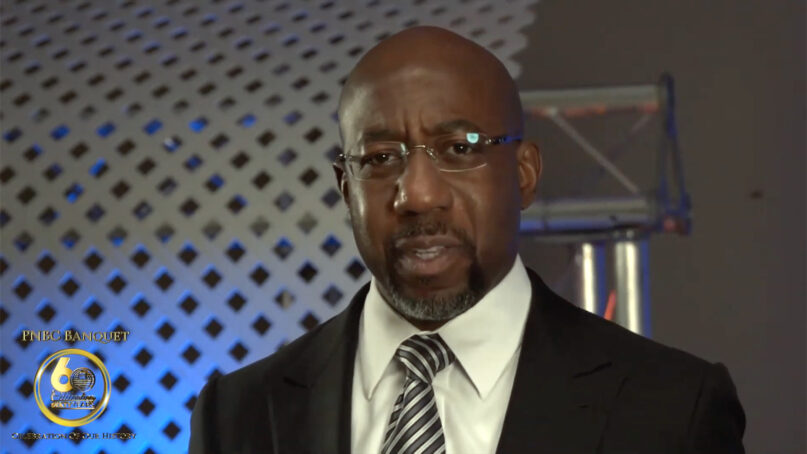 The Rev. Raphael Warnock addresses a virtual 60th annual gathering of the Progressive National Baptist Convention, Wednesday, Aug. 4, 2021. Video screengrab