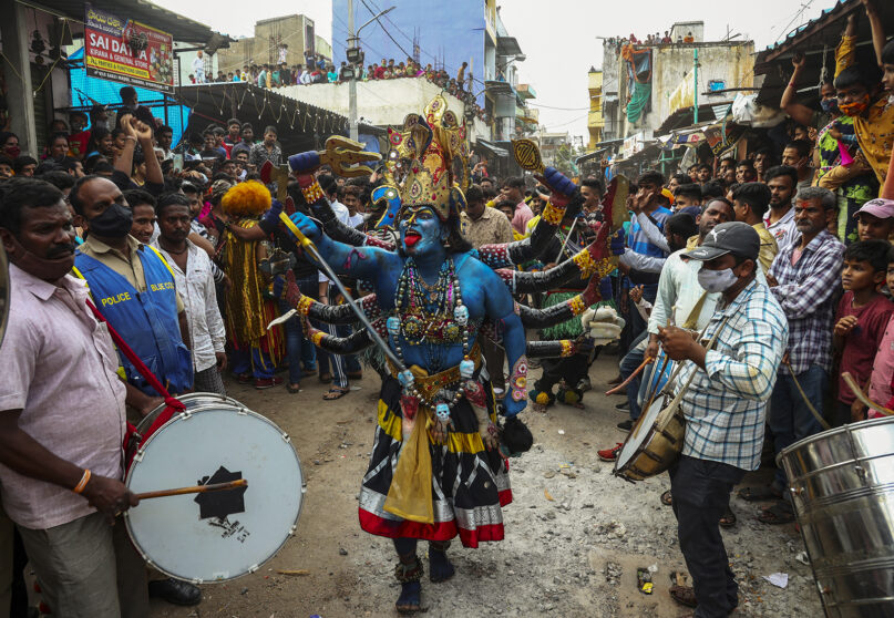 A Hindu devotee dressed like goddess Kali dances during the Bonalu festival in Hyderabad, India, Aug. 1, 2021. Bonalu is a monthlong Hindu folk festival of the Telangana region dedicated to Kali, the Hindu goddess of destruction. (AP Photo/Mahesh Kumar A.)