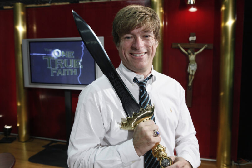 In this Oct. 11, 2010 file photo, Michael Voris holds a sword used when he records for RealCatholicTV.com in a studio in Ferndale, Mich.  (AP Photo/Paul Sancya)
