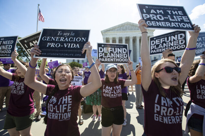  In this June 25, 2018, file photo, anti-abortion advocates demonstrate in front of the Supreme Court in Washington. (AP Photo/J. Scott Applewhite, File)