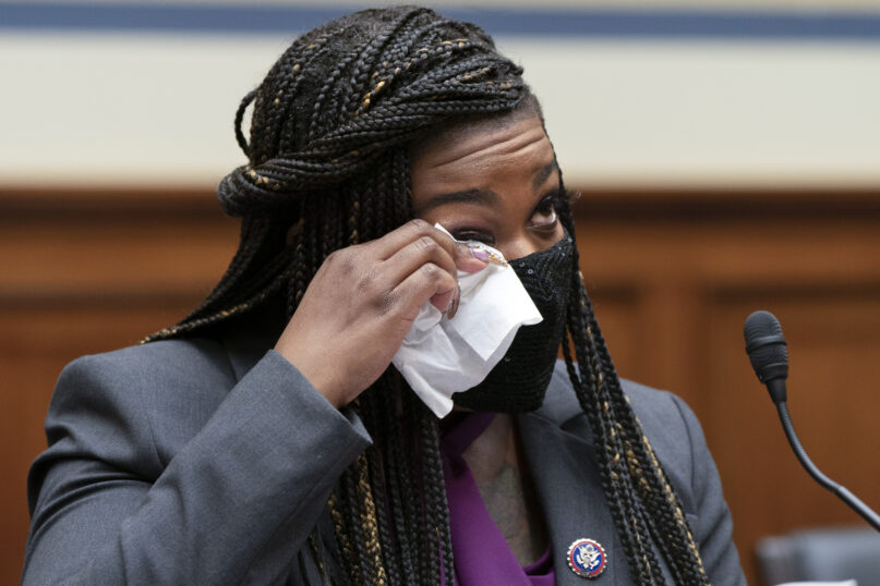 Rep. Cori Bush, D-Mo., wipes away a tear as she prepares to testify about her experience being raped and a subsequent abortion, Thursday, Sept. 30, 2021, during a House Committee on Oversight and Reform hearing on Capitol Hill in Washington. (AP Photo/Jacquelyn Martin)