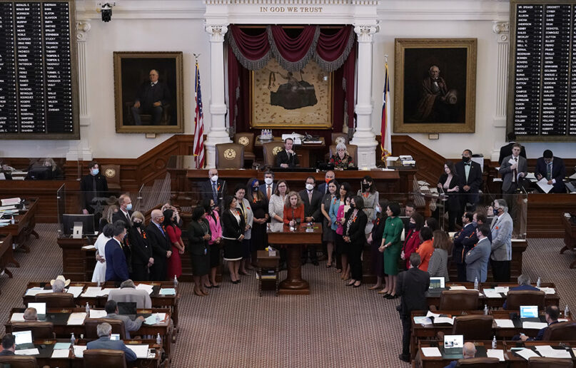 FILE - In this May 5, 2021, file photo, Texas state Rep. Donna Howard, D-Austin, center at lectern, stands with fellow lawmakers in the House Chamber in Austin, Texas, as she opposes a bill introduced that would ban abortions as early as six weeks and allow private citizens to enforce it through civil lawsuits, under a measure given preliminary approval by the Republican-dominated House. A Texas law banning most abortions in the state took effect at midnight on Sept. 1 but the Supreme Court has yet to act on an emergency appeal to put the law on hold. If allowed to remain in force, the law would be the most dramatic restriction on abortion rights in the United States since the high court’s landmark Roe v. Wade decision legalized abortion across the country in 1973. (AP Photo/Eric Gay, File)