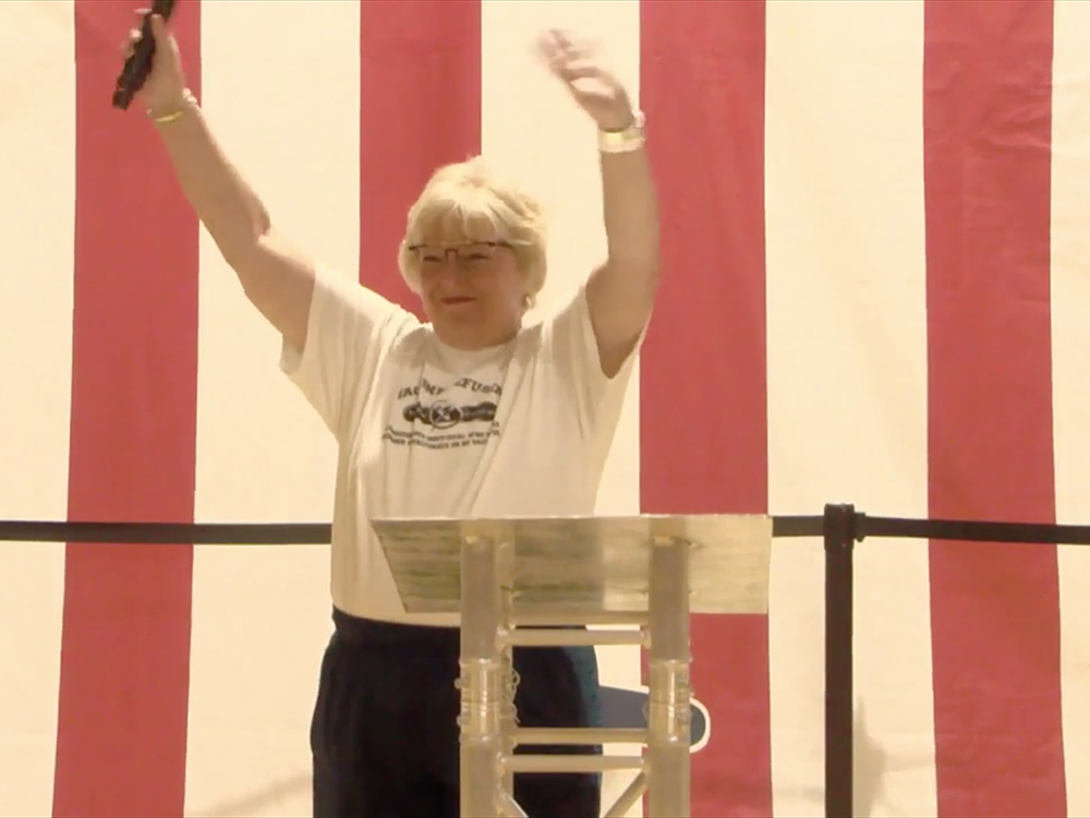 Dr. Sherri Tenpenny waves to the crowd at Bards Fest in St. Louis. Video screengrab