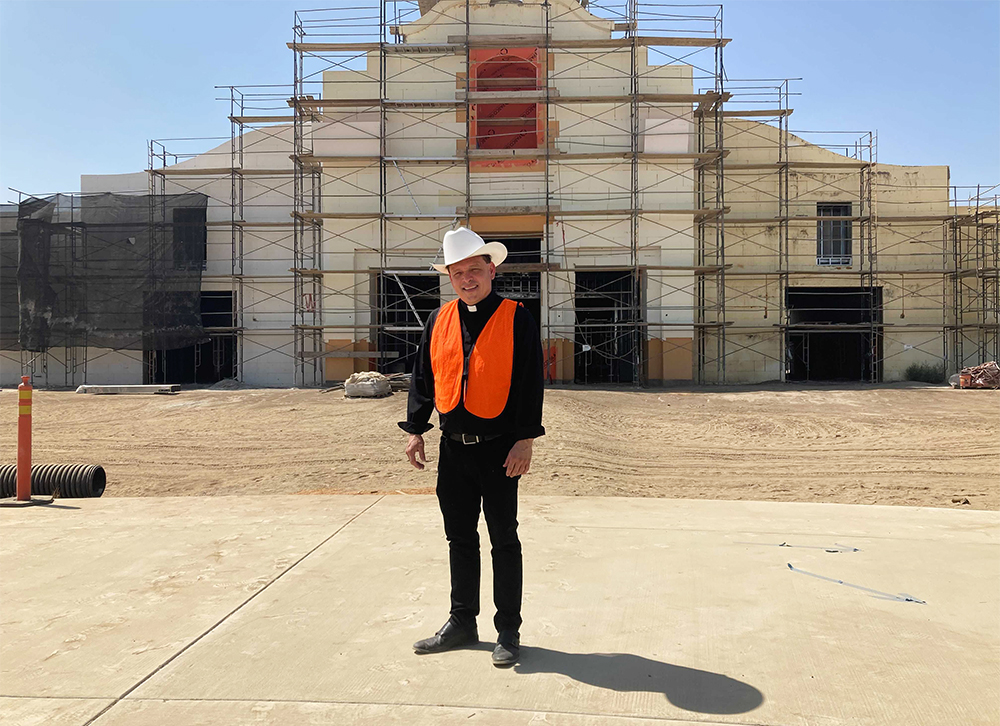 The Rev. Alex Chavez in front of the St. Charles Borromeo Catholic Church construction site in Visalia, California, Thursday, Aug. 26, 2021. RNS photo by Alejandra Molina