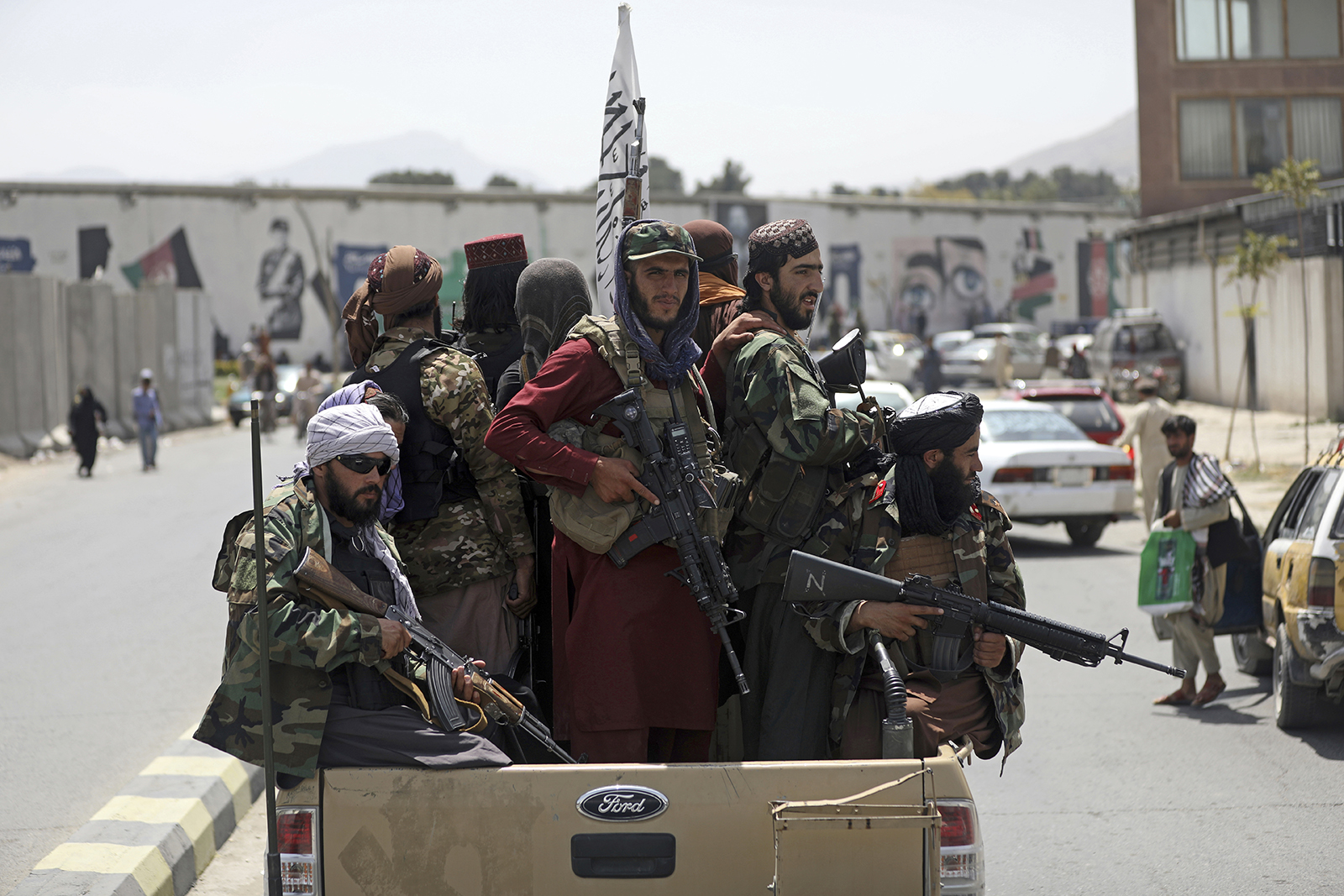 In this Aug. 19, 2021, file photo, Taliban fighters patrol in Kabul, Afghanistan. In the U.S. departure from Afghanistan, China has seen the realization of long-held hopes for a reduction of the influence of a geopolitical rival in what it considers its backyard. Yet, it is also deeply concerned that the very withdrawal could bring instability to that backyard — Central Asia — and possibly even spill over the border into China itself in its heavily Muslim northwestern region of Xinjiang. (AP Photo/Rahmat Gul, File)