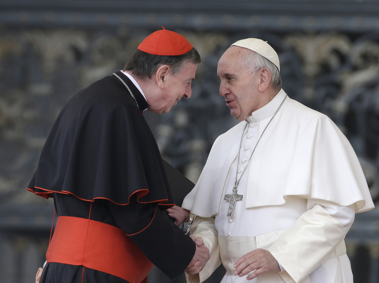 Pope Francis greets Cardinal Kurt Koch during his weekly general audience in St. Peter's Square at the Vatican, Wednesday, Oct. 28, 2015. (AP Photo/Alessandra Tarantino)