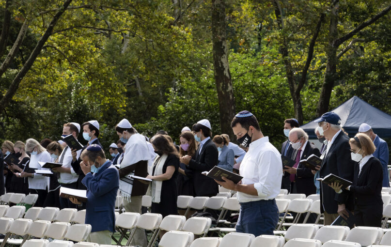 Congregants attend a Yom Kippur service held in Central Park by Temple Emanu-El, Thursday, Sept. 16, 2021, in New York. The Jewish service is being held outdoors so that worshippers feel comfortable and safe during the coronavirus pandemic. (AP Photo/Mark Lennihan)