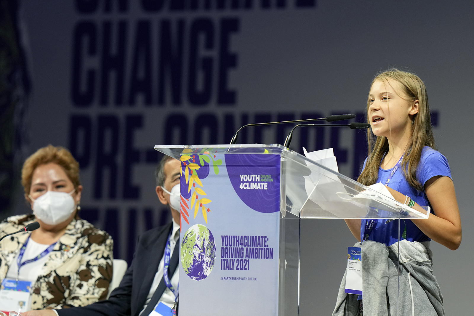 Swedish climate activist Greta Thunberg speaks during a three-day Youth for Climate summit in Milan, Italy, Tuesday, Sept. 28, 2021. Sitting at left is Patricia Espinosa, Executive Secretary of the United Nations Framework Convention on Climate Change (UNFCCC). (AP Photo/Luca Bruno)