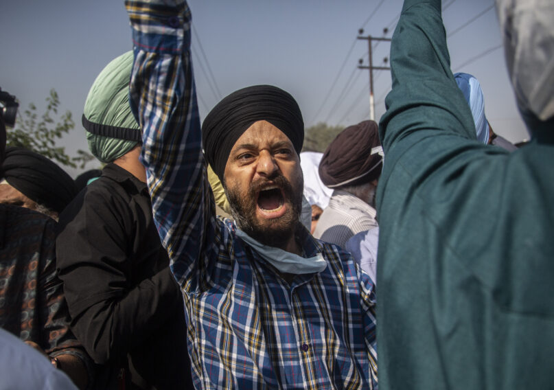 FILE - In this Oct. 8, 2021, file photo, Sikh community members shout slogans during the funeral of Supinder Kaur, a slain school principal in Srinagar, India. A spate of recent killings has rattled Indian-controlled Kashmir, with violence targeting local minority members and Indian civilians from outside the disputed region. (AP Photo/Mukhtar Khan, File)