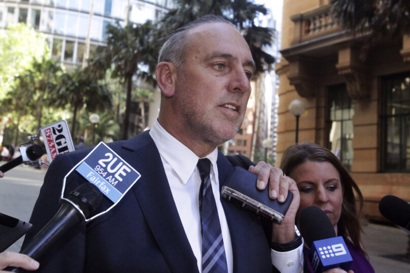 Founder of the Sydney-based global Hillsong Church, Brian Houston, leaves the Royal Commission into Institutional Responses to Child Sexual Abuse hearings in Sydney, Oct. 7, 2014. Houston will plead not guilty to a charge that he illegally concealed his father's alleged child abuse his lawyer told a court on Tuesday, Oct. 5, 2021. (Mick Tsikas/AAP Image via AP)