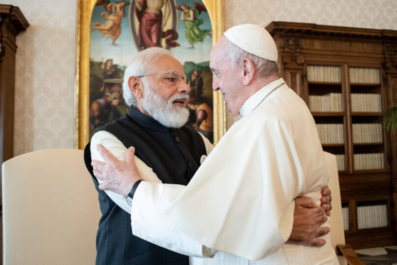 India's Prime Minister Narendra Modi, left, and Pope Francis hug on the occasion of their private audience at the Vatican, Saturday, Oct. 30, 2021. (Vatican Media via AP)