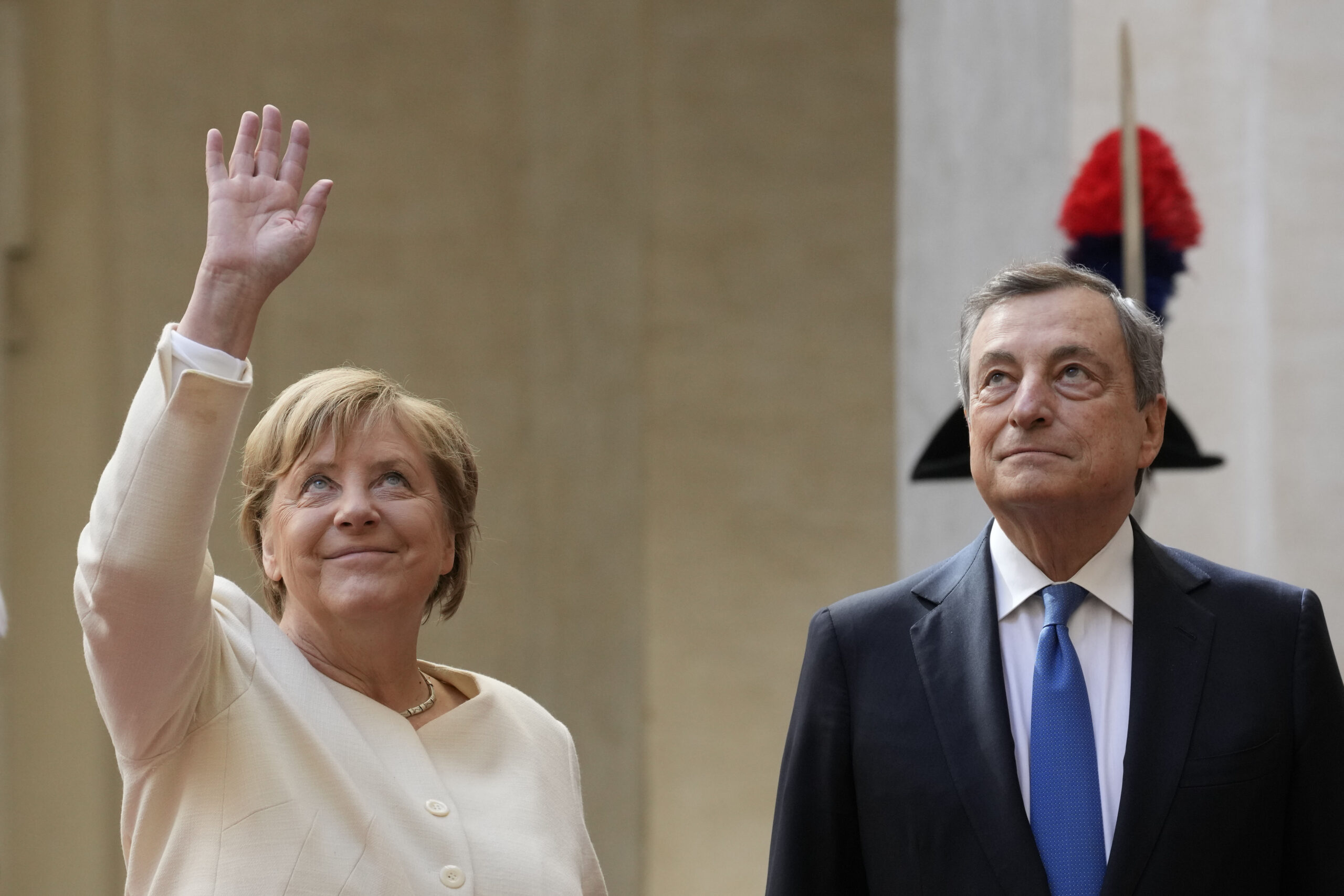 Merkel meets pope and receives farewell tribute from Draghi