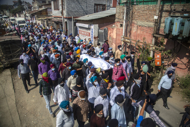 FILE-In this Oct. 8, 2021 file photo, Sikh community members carry the body of slain Satinder Kaur, a government school teacher during her funeral procession in Srinagar, India. Government forces have detained at least 500 people in a sweeping crackdown in Indian-controlled Kashmir, local officials said Sunday, following a string of suspected militant attacks and targeted killings in the disputed region. (AP Photo/Mukhtar Khan, File)