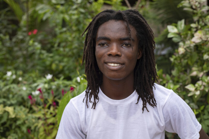 Tyrone Iras Marhguy, 17, pose for a photograph at his home in Accra, Ghana, Sunday, Oct. 10, 2021. An official at the academically elite Achimota School in Ghana told the teen he would have to cut his dreadlocks before enrolling. For Marhguy, who is a Rastafarian, cutting his dreadlocks is non-negotiable so he and his family asked the courts to intervene. (AP Photo/Nipah Dennis)