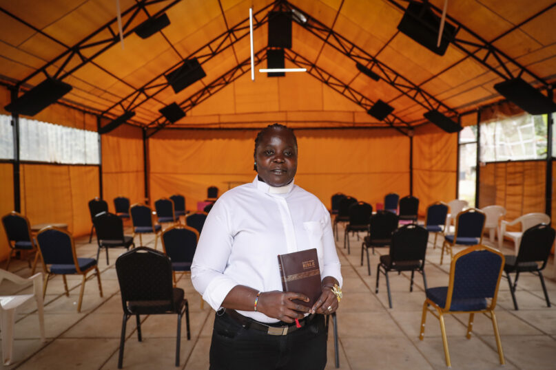Associate Pastor Caroline Omolo stands for a portrait at the Cosmopolitan Affirming Community church, which serves a predominantly LGBTQ congregation, in Nairobi, Kenya Monday, Oct. 11, 2021. “They have always organized a group to maybe silence us or make the church disappear,” Omolo says. “They don’t want it to appear anywhere.” (AP Photo/Brian Inganga)