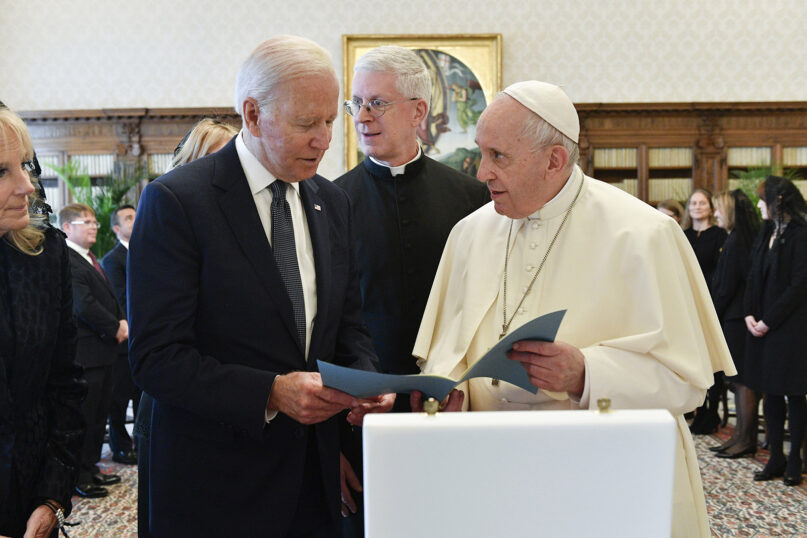 President Joe Biden, left, exchanges gifts with Pope Francis as they meet at the Vatican, Oct. 29, 2021. Photo by Vatican Media