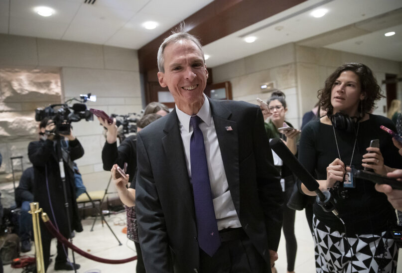 Rep. Dan Lipinski, D-Ill., is met by reporters as he leaves the Democratic Caucus leadership elections at the Capitol in Washington, Wednesday, Nov. 28, 2018. (AP Photo/J. Scott Applewhite)