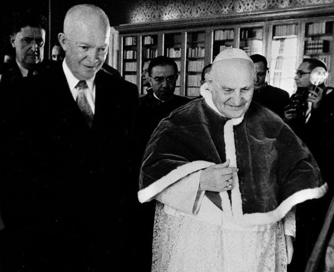 FILE- In this Dec. 6, 1959 file photo, President Dwight D. Eisenhower walks with Pope John XXIII at the Vatican. (AP Photo/Paul Schutzer, File)