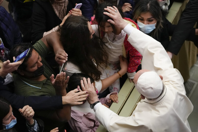 Pope Francis greets people at the end of his weekly general audience in the Pope Paul VI Hall at the Vatican, Oct. 20, 2021. (AP Photo/Alessandra Tarantino)