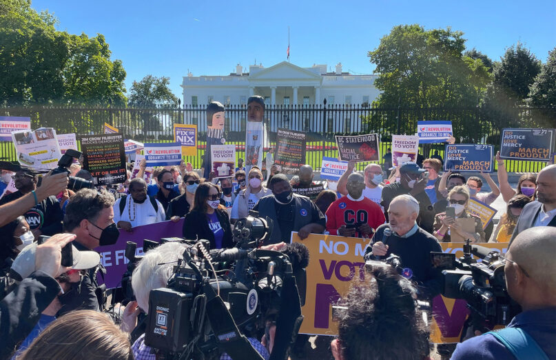 Rabbi David Saperstein, center right with microphone, speaks during a voting rights rally outside the White House on Oct. 19, 2021, in Washington. RNS photo by Jack Jenkins