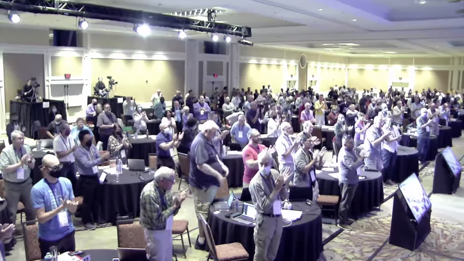 Delegates of the Reformed Church in America’s 214th General Synod applaud the Vision 2020 team in Tucson, Arizona, Saturday, Oct. 16, 2021. Video screengrab
