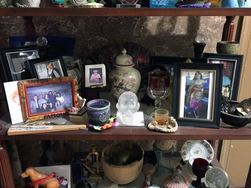Bridget Sidhe-Lyric's shelf of photos and mementos honoring departed Wiccan friends. Photo courtesy of Bridget Sidhe-Lyric