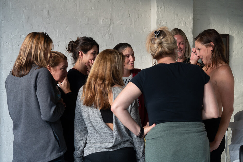 A group of women surround tattoo client, right, at David Allen's studio in Chicago. Photo courtesy of David Allen
