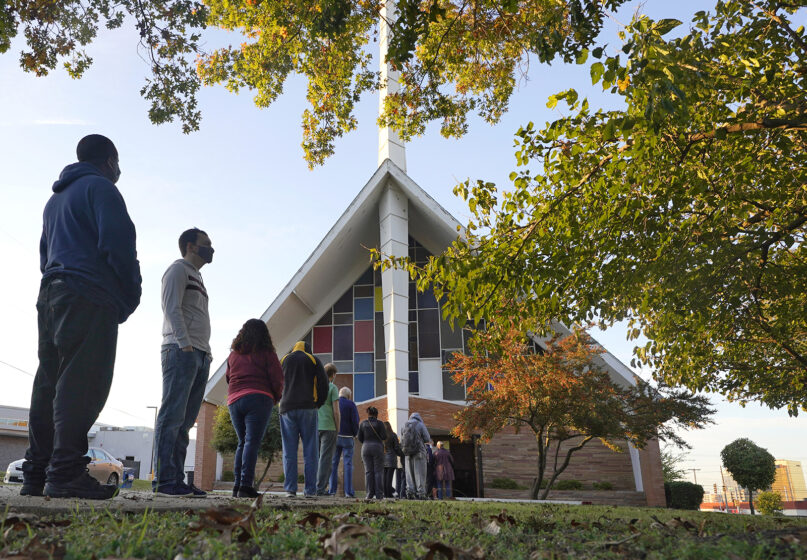 FILE - In this Nov. 3, 2020, file photo, voters line up outside Vickery Baptist Church waiting to cast their ballots on Election Day in Dallas. (AP Photo/LM Otero, File)