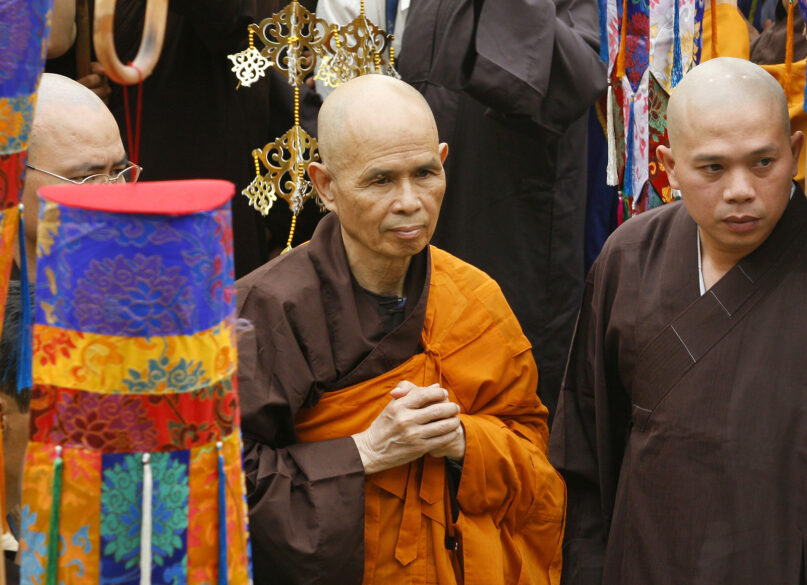 FILE - In this March 16, 2007 file photo, Vietnamese monk Thích Nhất Hạnh, center, arrives for a Great Chanting Ceremony at Vinh Nghiem Pagoda in Ho Chi Minh City, southern Vietnam. (AP Photo)